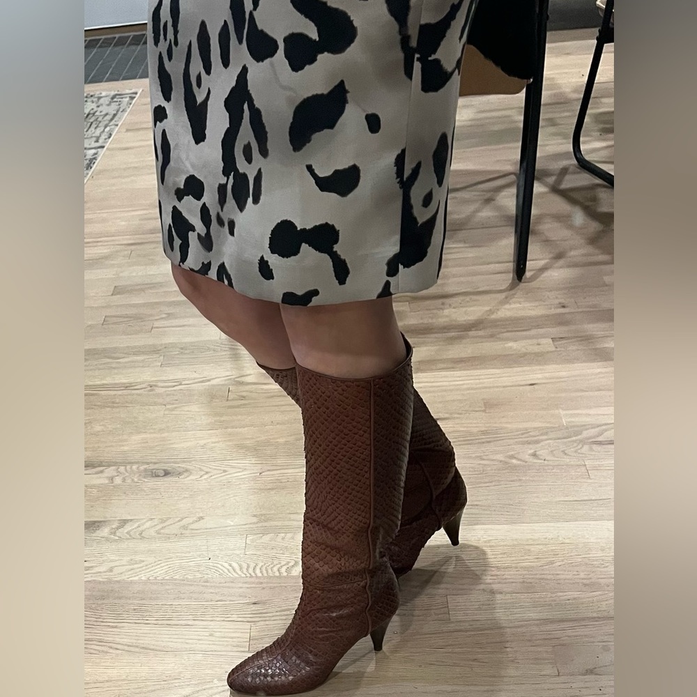 Tall boots with high heel (3 ‘) brown sneak skin leather.